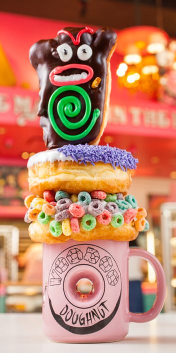 Over-the-top triple-stacked dessert at VooDoo Donuts